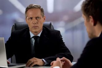 A tense office scene illustrates concerns about unqualified trainers in the vet sector.